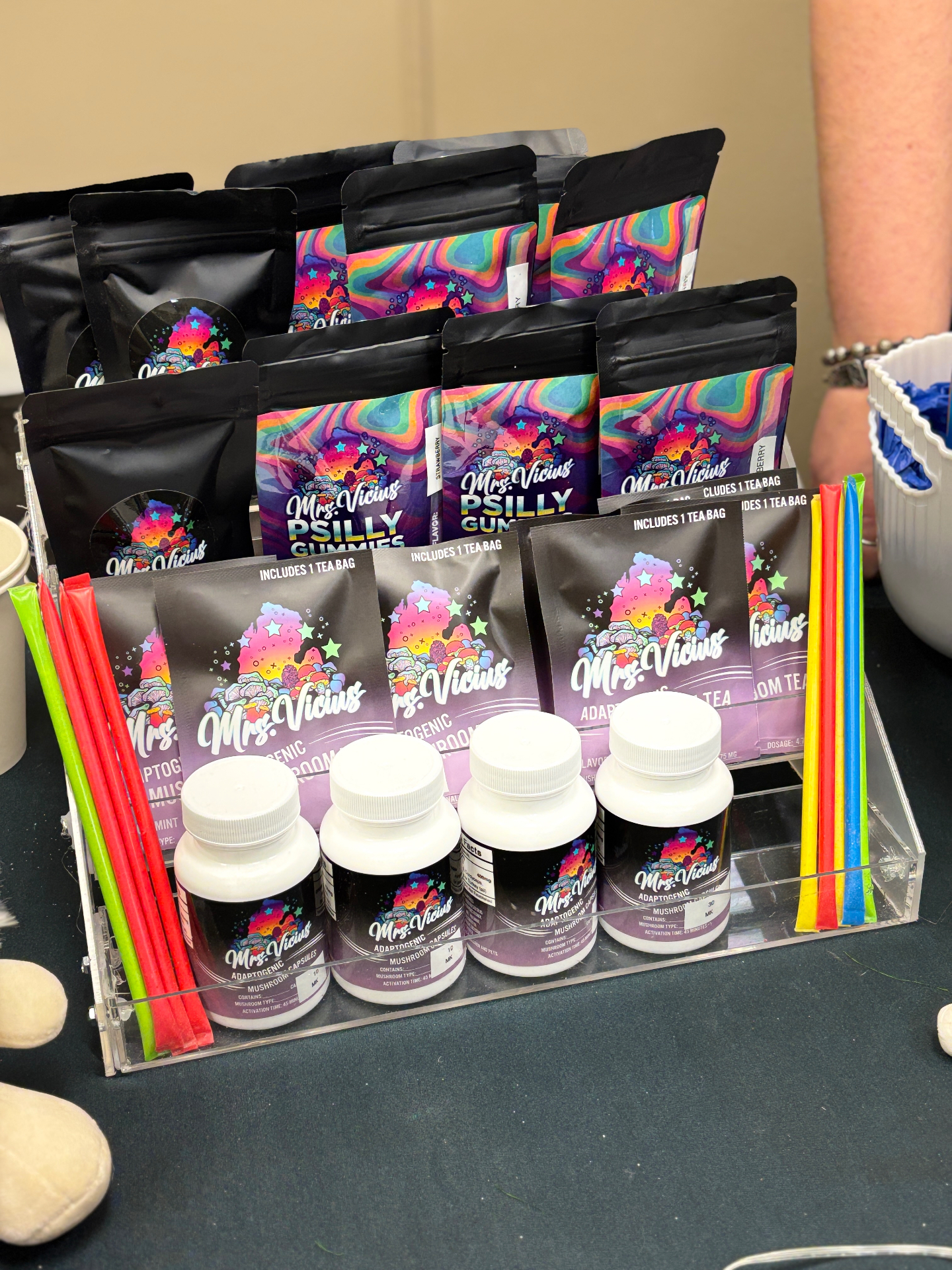 Mrs. Vicius mushroom teas, gummies, and bottled products at a community market